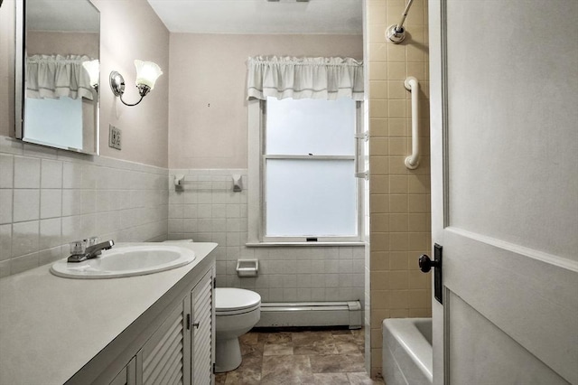 14 Lyman Ter, Waltham, MA 02452 - bathroom featuring a baseboard heating unit, tile walls, vanity, toilet, and bathtub / shower combination