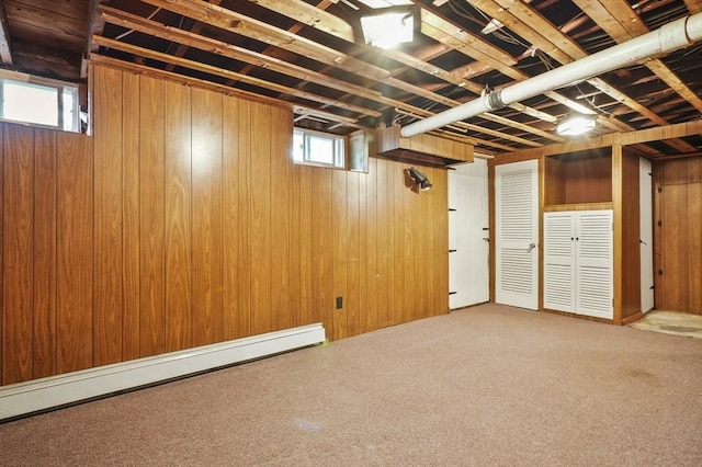 14 Lyman Ter, Waltham, MA 02452 - basement featuring baseboard heating, carpet, and wooden walls