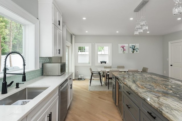 6 Fallon Cir, Braintree, MA 02184 - kitchen featuring white microwave, a sink, stainless steel dishwasher, tasteful backsplash, and recessed lighting