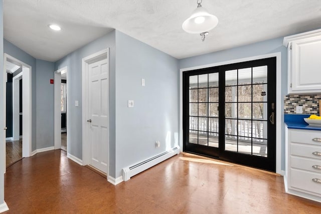 doorway to outside featuring baseboards, baseboard heating, and recessed lighting