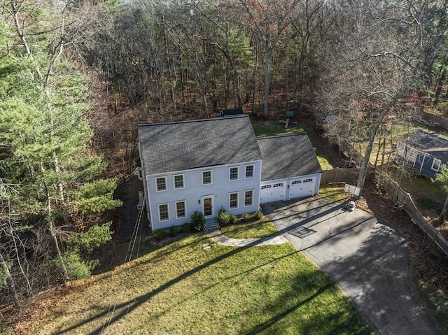 birds eye view of property with a wooded view