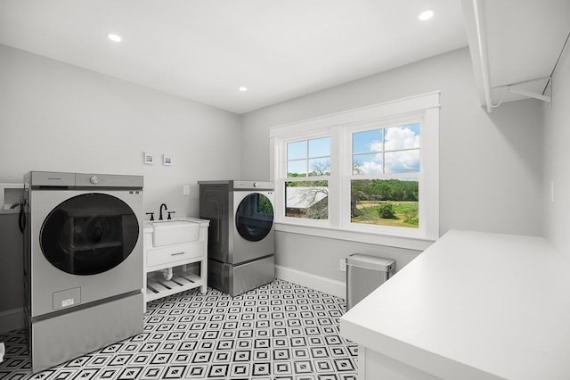 washroom with sink and washing machine and dryer