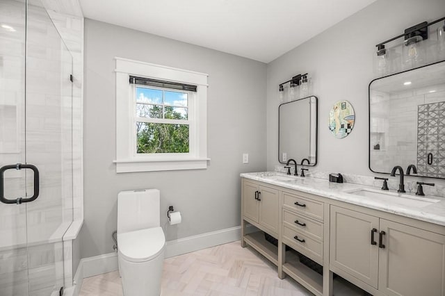 bathroom with vanity, parquet flooring, a shower with door, and toilet