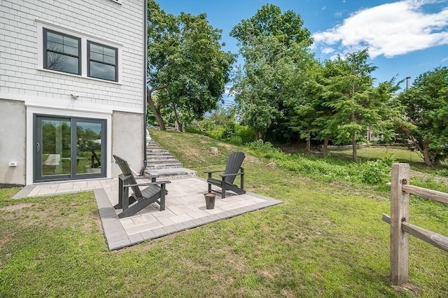 view of yard featuring a patio area and french doors