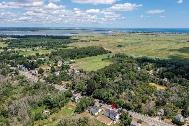 drone / aerial view featuring a water view and a rural view