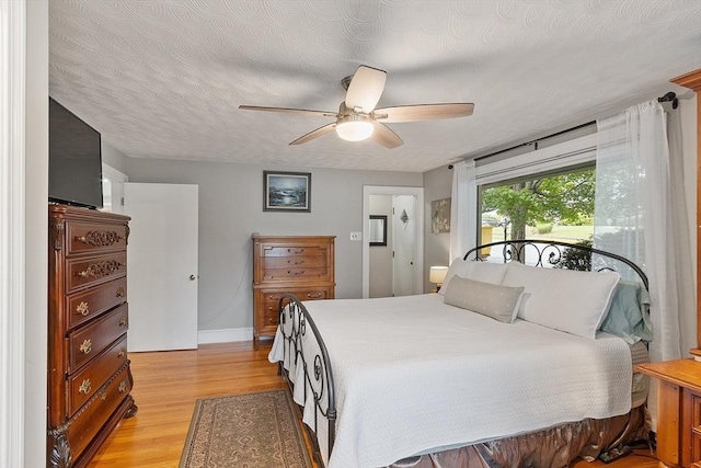 34 Woodland Cir, Methuen, MA 01844 - bedroom featuring light wood-type flooring, baseboards, and a ceiling fan