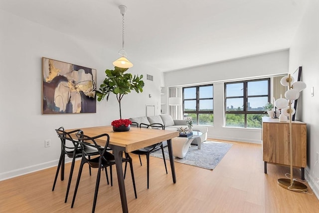 931 Massachusetts Ave Unit 606, Cambridge, MA 02139 - dining space featuring light wood finished floors and baseboards