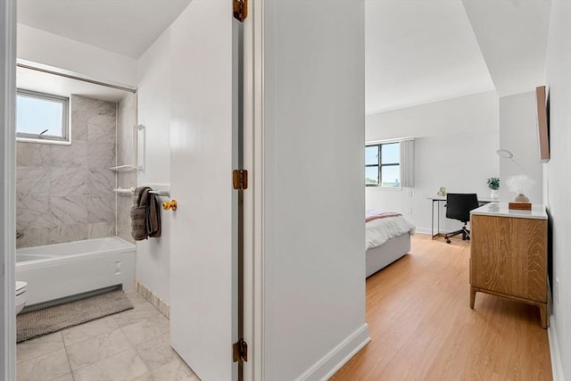 931 Massachusetts Ave Unit 606, Cambridge, MA 02139 - full bathroom with plenty of natural light, bathtub / shower combination, and ensuite bath