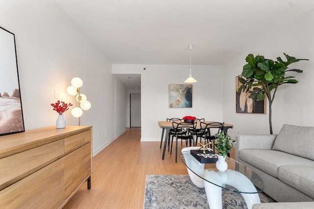 931 Massachusetts Ave Unit 606, Cambridge, MA 02139 - living area with light wood-style floors and baseboards