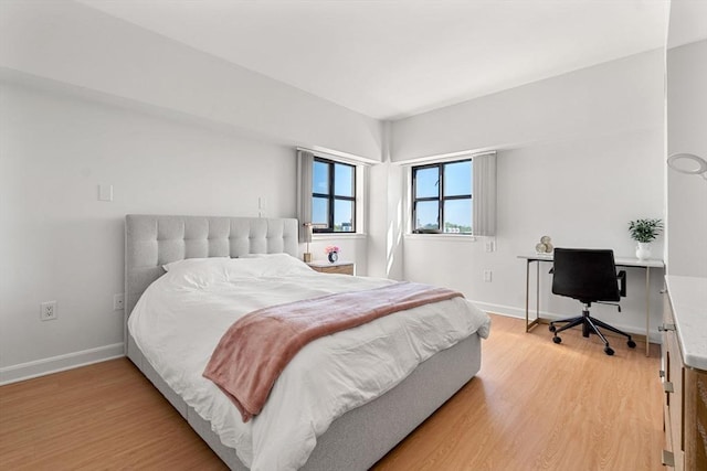 931 Massachusetts Ave Unit 606, Cambridge, MA 02139 - bedroom featuring light wood finished floors and a desk