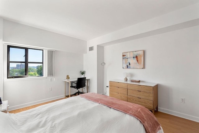 931 Massachusetts Ave Unit 606, Cambridge, MA 02139 - bedroom with light wood-style flooring and an office area