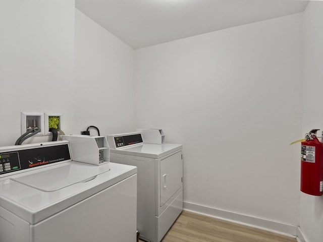 15-17 W Chestnut St, Brockton, MA 02301 - community laundry room featuring independent washer and dryer and light wood-style flooring