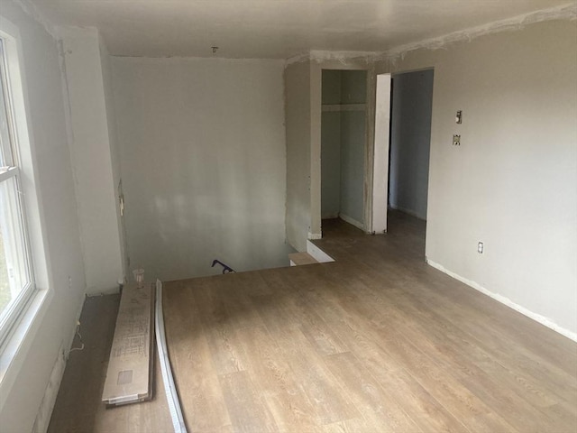unfurnished room featuring wood finished floors
