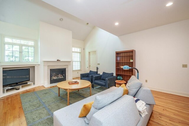 97 High Pine Cir Unit 97, Wilbraham, MA 01095 - living room with a fireplace, wood finished floors, baseboards, recessed lighting, and high vaulted ceiling