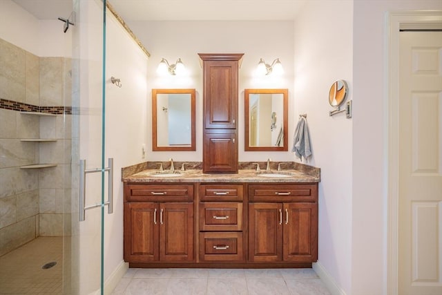 97 High Pine Cir Unit 97, Wilbraham, MA 01095 - bathroom with a shower stall, baseboards, double vanity, and tile patterned flooring