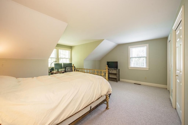 97 High Pine Cir Unit 97, Wilbraham, MA 01095 - bedroom with light carpet, lofted ceiling, and baseboards