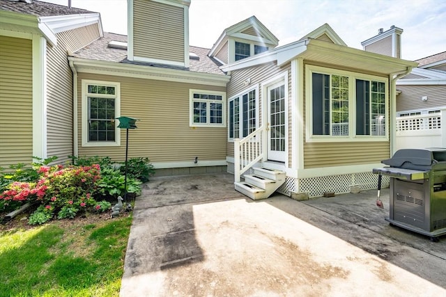 97 High Pine Cir Unit 97, Wilbraham, MA 01095 - back of house with entry steps, a patio, a chimney, and a shingled roof