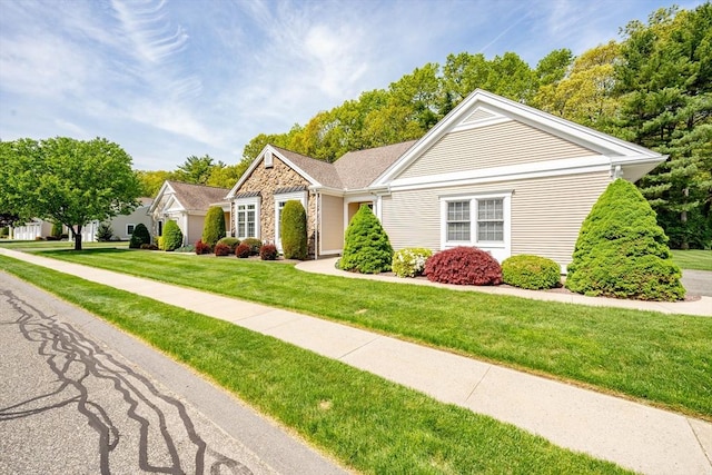 97 High Pine Cir Unit 97, Wilbraham, MA 01095 - view of front facade with a front yard, an attached garage, and stone siding