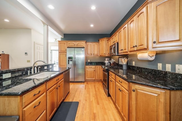 97 High Pine Cir Unit 97, Wilbraham, MA 01095 - kitchen featuring appliances with stainless steel finishes, a sink, light wood-style flooring, dark stone counters, and recessed lighting