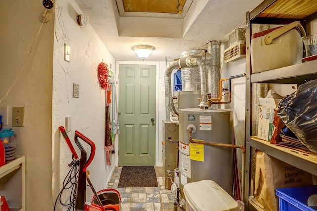 utility room featuring gas water heater