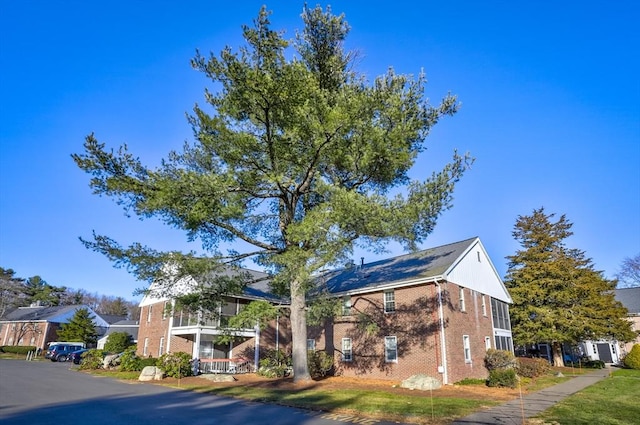 view of home's exterior with a balcony