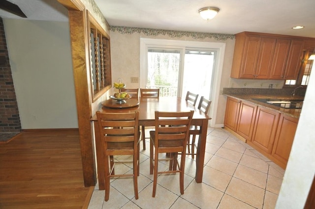 dining space featuring baseboards, light tile patterned floors, and recessed lighting