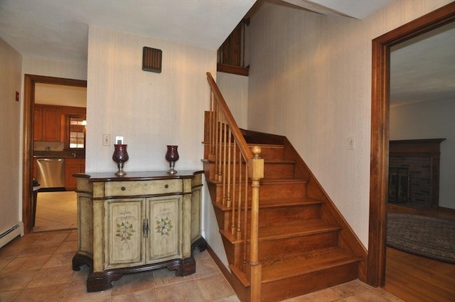 staircase with a fireplace