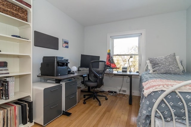 bedroom with light wood-type flooring