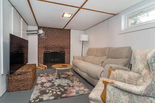 living room featuring a fireplace and concrete flooring