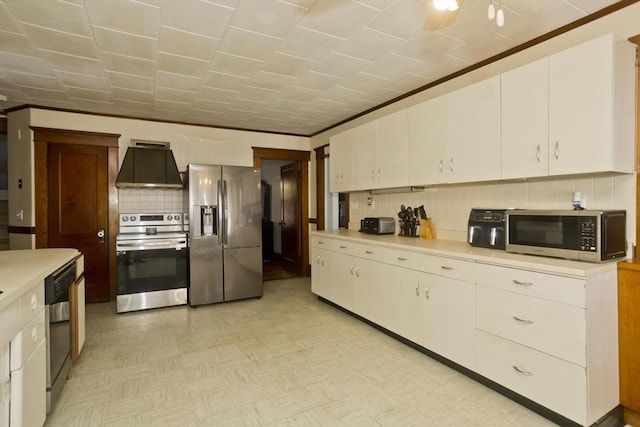 kitchen featuring stainless steel appliances, light countertops, white cabinetry, and range hood