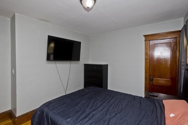 bedroom featuring baseboards