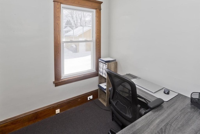 office with plenty of natural light and carpet flooring