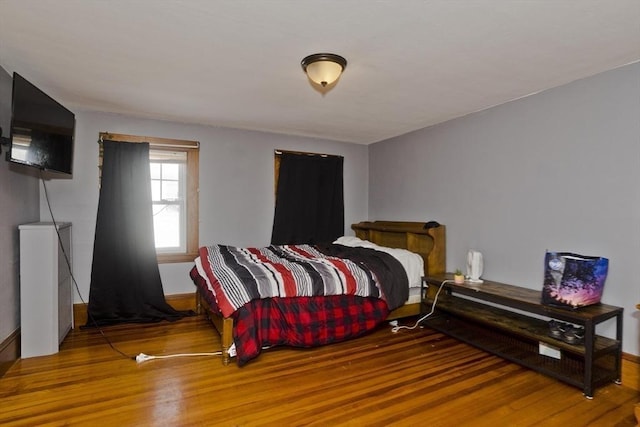 bedroom featuring wood finished floors