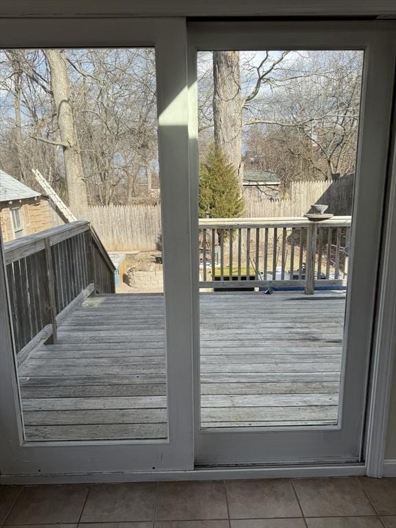 doorway to outside featuring tile patterned floors