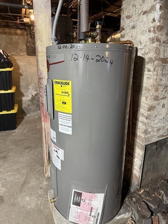 utility room featuring electric water heater