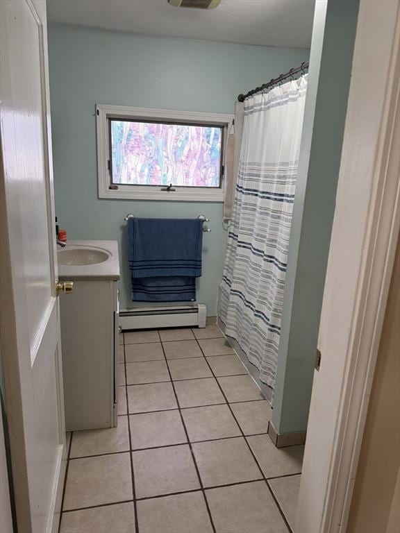 full bathroom with tile patterned floors, baseboard heating, vanity, and a shower with curtain