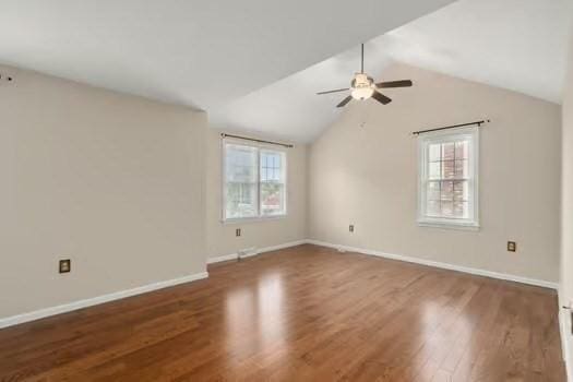 5 Saint John Ln Unit 5, Milford, MA 01757 - empty room with healthy amount of natural light, a ceiling fan, wood finished floors, and lofted ceiling