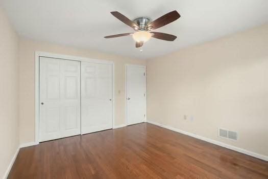 5 Saint John Ln Unit 5, Milford, MA 01757 - unfurnished bedroom with wood finished floors, a closet, and ceiling fan