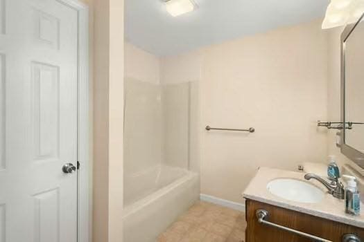 5 Saint John Ln Unit 5, Milford, MA 01757 - bathroom featuring vanity, tile patterned floors, and shower / bathtub combination