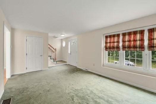 5 Saint John Ln Unit 5, Milford, MA 01757 - unfurnished living room with stairs and carpet flooring