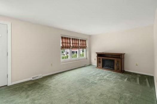 5 Saint John Ln Unit 5, Milford, MA 01757 - unfurnished living room with carpet floors and a fireplace