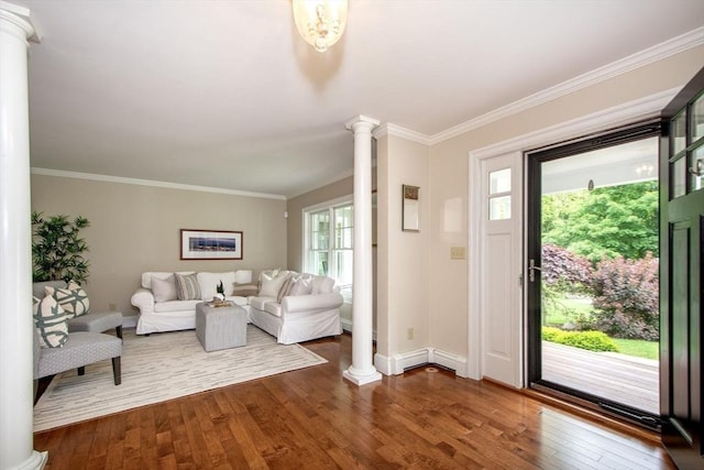 265 King St, Cohasset, MA 02025 - foyer with decorative columns, dark wood-type flooring, and ornamental molding