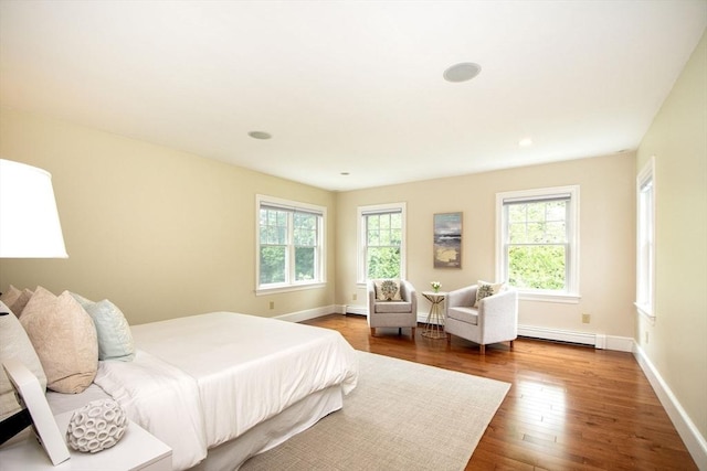 265 King St, Cohasset, MA 02025 - bedroom featuring a baseboard heating unit, wood finished floors, and recessed lighting