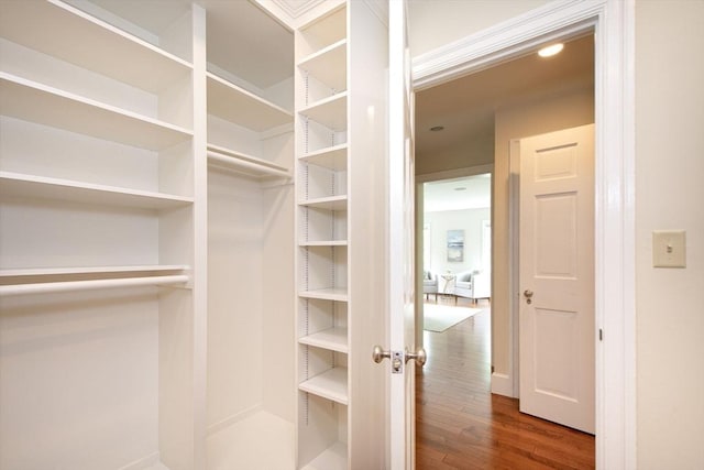 265 King St, Cohasset, MA 02025 - walk in closet featuring wood finished floors