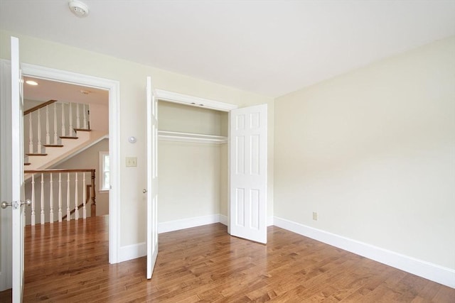 265 King St, Cohasset, MA 02025 - unfurnished bedroom featuring wood finished floors and a closet