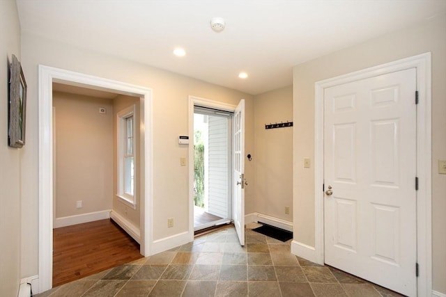 265 King St, Cohasset, MA 02025 - entrance foyer featuring recessed lighting, stone finish floors, and baseboard heating