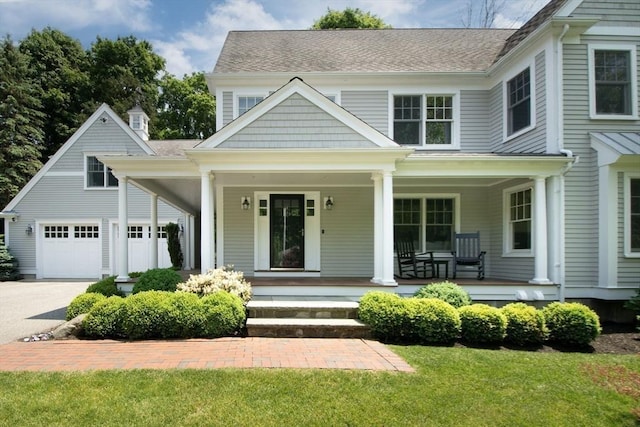 265 King St, Cohasset, MA 02025 - view of front of house featuring a porch, driveway, and a front yard