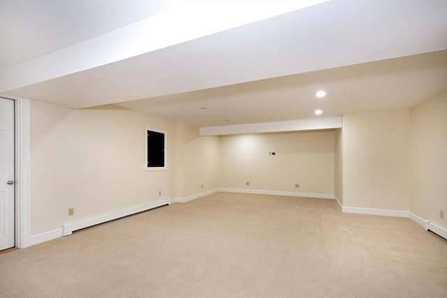 265 King St, Cohasset, MA 02025 - finished basement with a baseboard radiator, light colored carpet, and recessed lighting