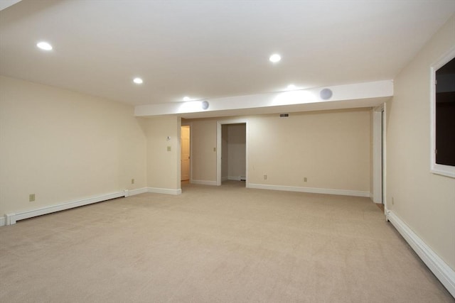 265 King St, Cohasset, MA 02025 - finished basement featuring a baseboard heating unit, light colored carpet, and recessed lighting