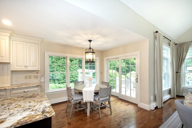 265 King St, Cohasset, MA 02025 - dining room featuring dark wood-style flooring, a baseboard heating unit, vaulted ceiling, and a chandelier